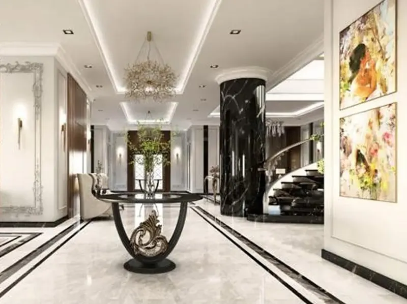 Entrance hall with a round table and a black marble column in a private villa, Al Khobar
