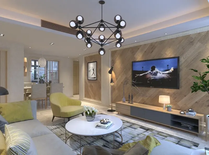 Living room with a wood-clad TV wall and yellow armchairs in a private villa